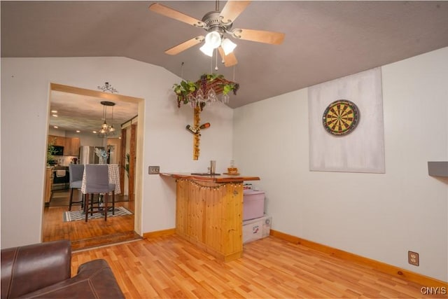 7735 Coates Rd N, Trenton, NY 13354 - living room featuring light wood-type flooring, a ceiling fan, baseboards, lofted ceiling, and a chandelier