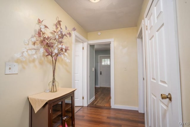 7735 Coates Rd N, Trenton, NY 13354 - hallway featuring dark wood finished floors and baseboards