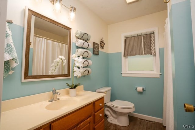 7735 Coates Rd N, Trenton, NY 13354 - bathroom featuring wood finished floors, vanity, toilet, and baseboards