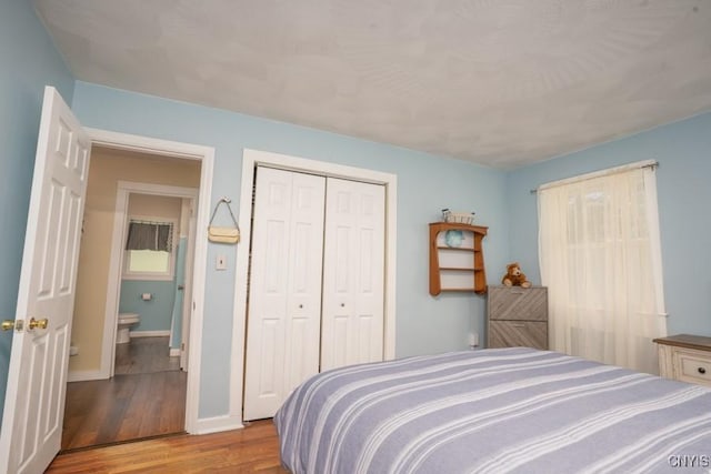 7735 Coates Rd N, Trenton, NY 13354 - bedroom featuring wood finished floors, a closet, and baseboards