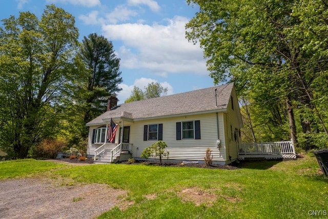 7735 Coates Rd N, Trenton, NY 13354 - view of front of house with a front yard, a chimney, and a deck