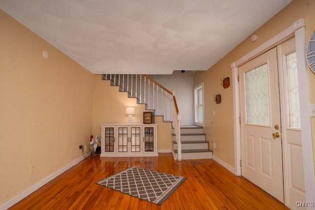 7735 Coates Rd N, Trenton, NY 13354 - entrance foyer featuring stairs, wood finished floors, and baseboards