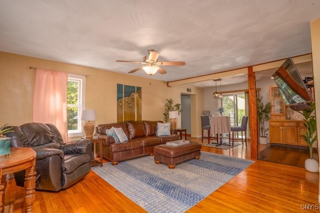 7735 Coates Rd N, Trenton, NY 13354 - living room with wood finished floors, healthy amount of natural light, and a ceiling fan