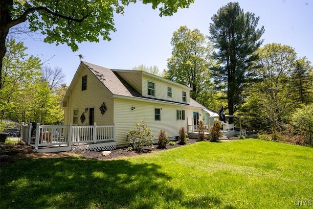 7735 Coates Rd N, Trenton, NY 13354 - rear view of house with a deck and a yard