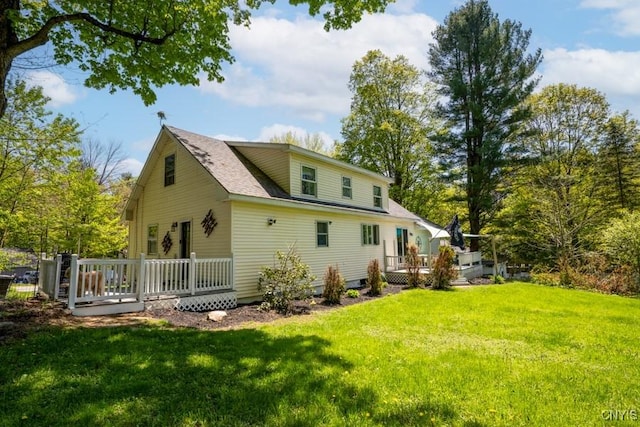 7735 Coates Rd N, Trenton, NY 13354 - rear view of house with a deck and a lawn