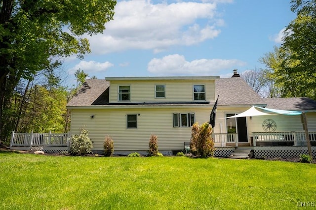 7735 Coates Rd N, Trenton, NY 13354 - back of property featuring a wooden deck, a lawn, and roof with shingles