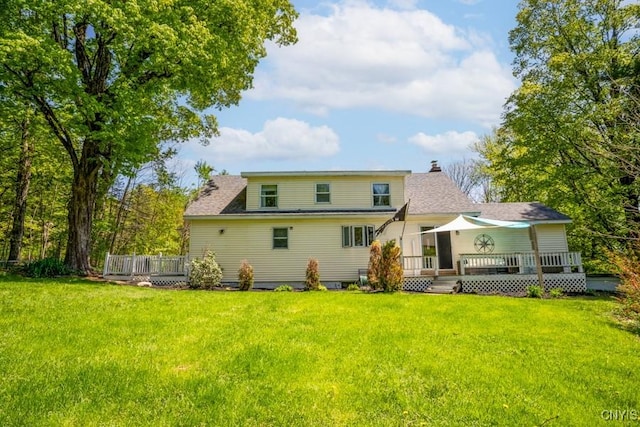7735 Coates Rd N, Trenton, NY 13354 - rear view of property featuring a wooden deck, a yard, and a chimney