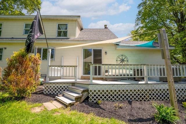 7735 Coates Rd N, Trenton, NY 13354 - rear view of property featuring a shingled roof and a deck