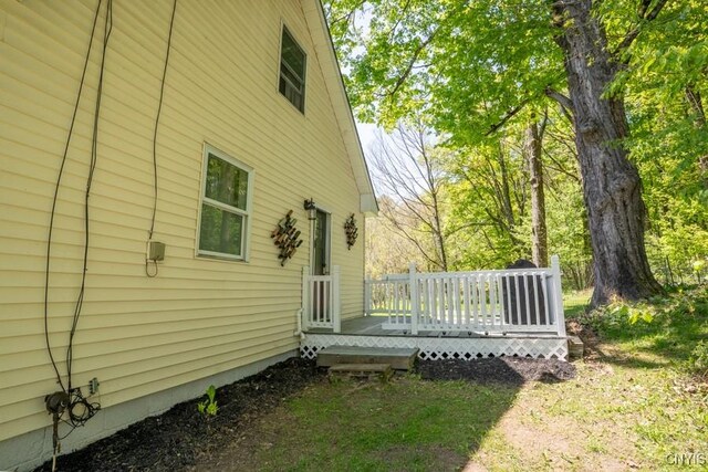 7735 Coates Rd N, Trenton, NY 13354 - view of side of home featuring a wooden deck