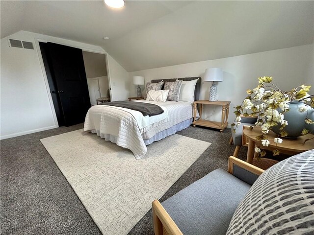 bedroom featuring carpet floors, lofted ceiling, and baseboards