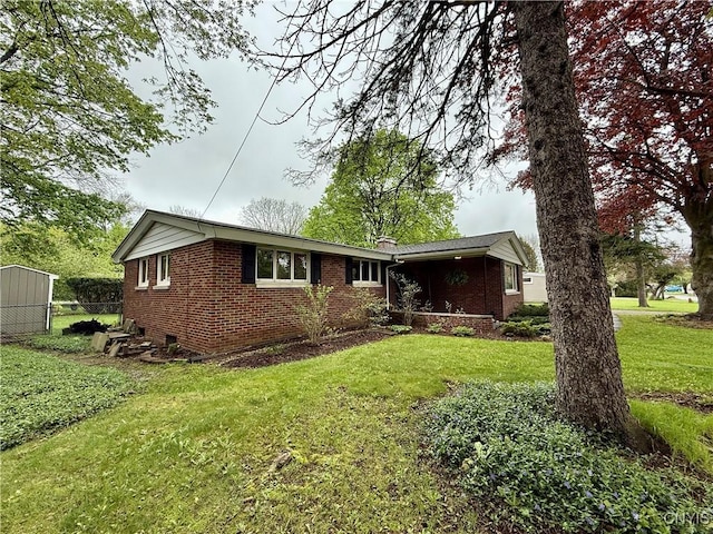 ranch-style house featuring brick siding