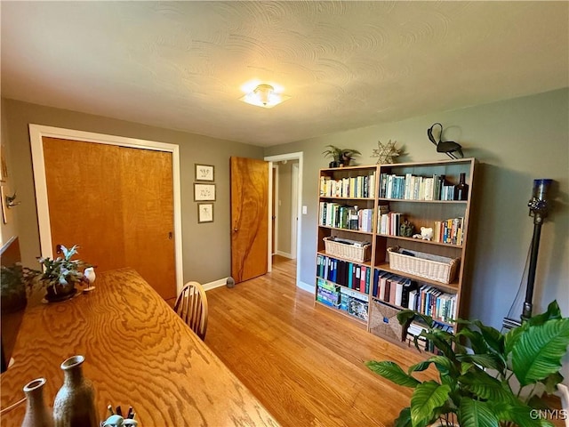 dining room with wood finished floors and baseboards