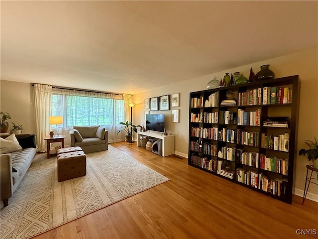 living room with wood finished floors and baseboards
