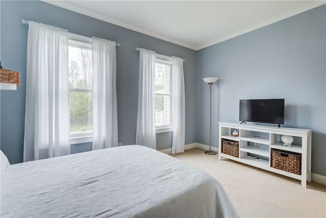 carpeted bedroom with baseboards