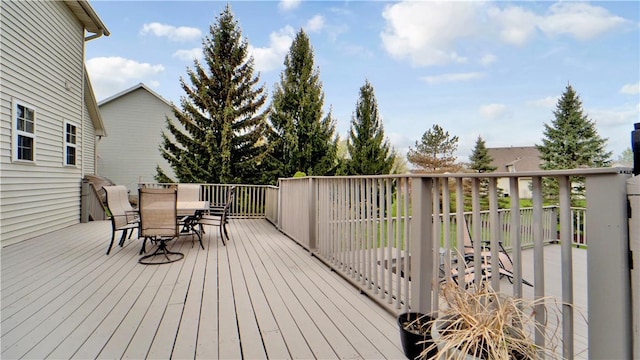 wooden deck featuring outdoor dining space