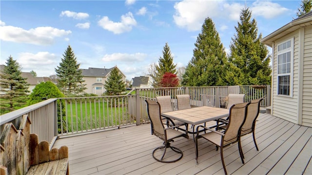 wooden terrace with outdoor dining space