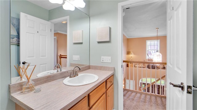 bathroom with vanity and ornamental molding