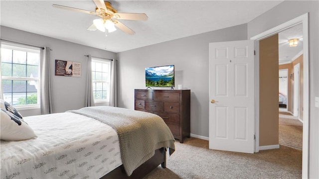 bedroom with carpet, baseboards, and ceiling fan
