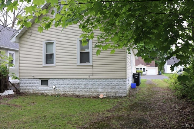 view of property exterior featuring a lawn