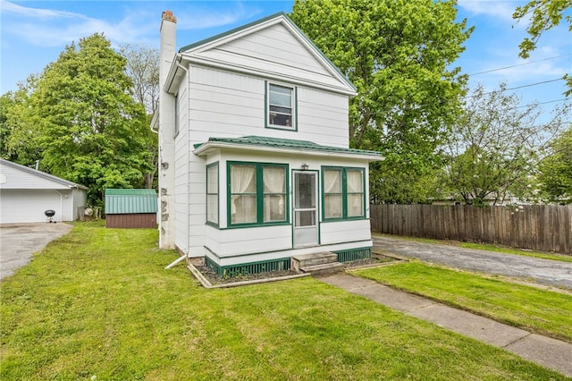 10 Clinton St, Bergen, NY 14416 - traditional style home with a chimney, entry steps, and an outdoor structure
