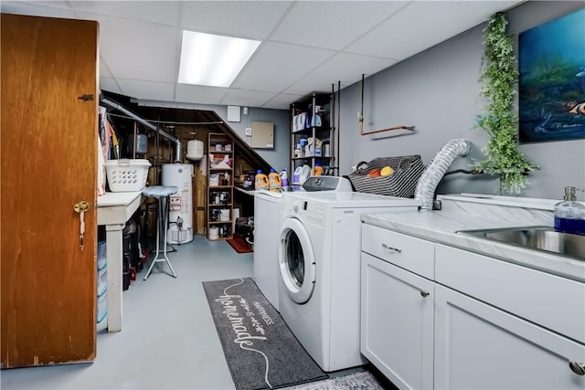 laundry area featuring gas water heater, independent washer and dryer, and cabinet space