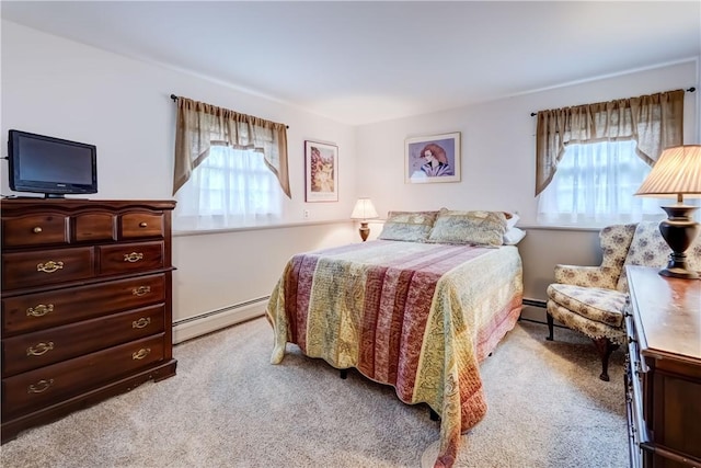 bedroom featuring light colored carpet, multiple windows, and a baseboard radiator