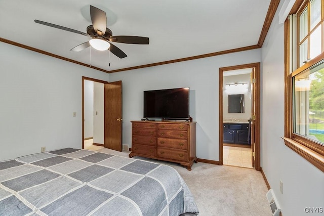 bedroom featuring light carpet, ensuite bathroom, a ceiling fan, ornamental molding, and baseboards