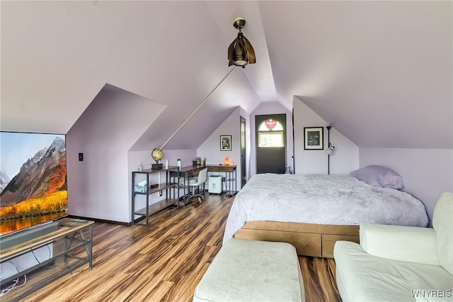 353 Campbell Rd, Sweden, NY 14420 - bedroom featuring wood finished floors and vaulted ceiling