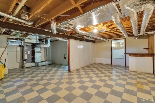 353 Campbell Rd, Sweden, NY 14420 - below grade area featuring tile patterned floors and heating unit