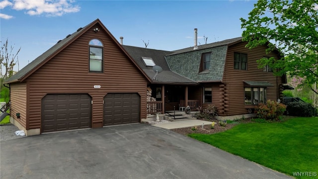 353 Campbell Rd, Sweden, NY 14420 - log home featuring covered porch, driveway, roof with shingles, a front lawn, and log siding