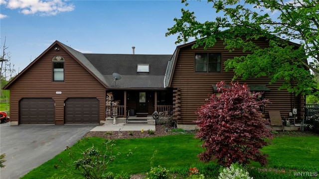353 Campbell Rd, Sweden, NY 14420 - log cabin featuring covered porch, driveway, log siding, roof with shingles, and a front lawn