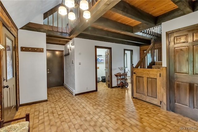353 Campbell Rd, Sweden, NY 14420 - interior space featuring baseboards, a chandelier, stairs, wood ceiling with exposed beams, and brick patterned floors