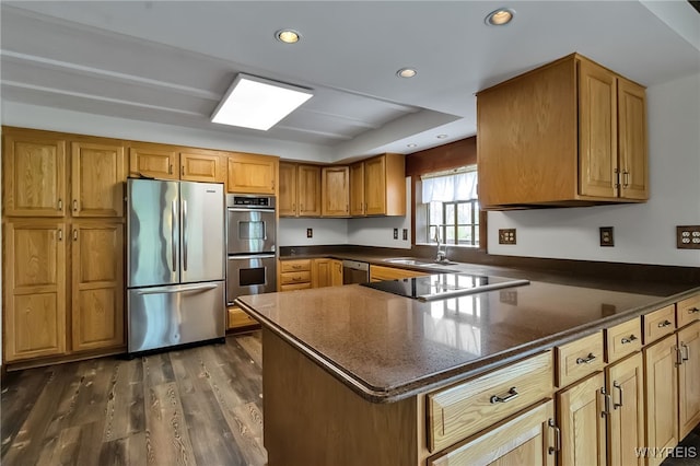 353 Campbell Rd, Sweden, NY 14420 - kitchen featuring stainless steel appliances, brown cabinetry, dark wood-style floors, a sink, and recessed lighting