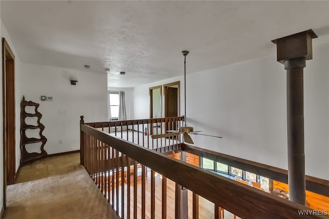 353 Campbell Rd, Sweden, NY 14420 - corridor featuring baseboards, an upstairs landing, and light carpet
