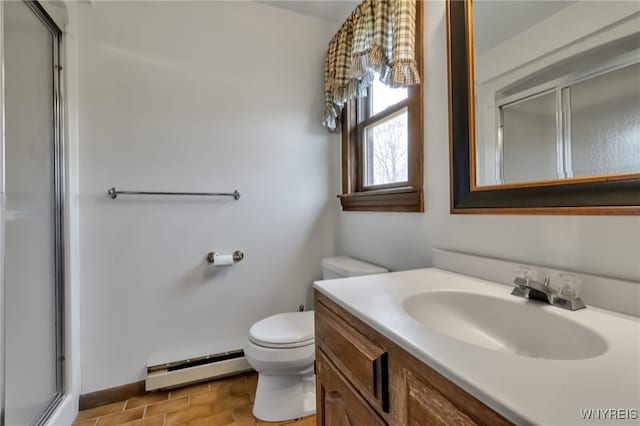 353 Campbell Rd, Sweden, NY 14420 - bathroom with a baseboard heating unit, vanity, toilet, a shower with shower door, and baseboards