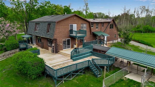 353 Campbell Rd, Sweden, NY 14420 - rear view of property featuring a gambrel roof, a wooden deck, roof with shingles, and log siding