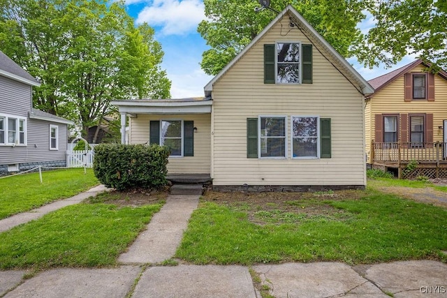 6 E 6th St, Oswego-City, NY 13126 - view of front of house featuring a front lawn