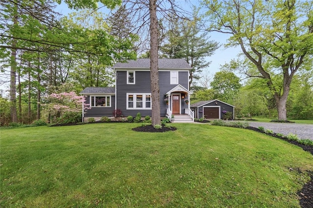 314 Hamilton St, Benton, NY 14527 - view of front facade featuring an outbuilding, driveway, a front yard, and a garage