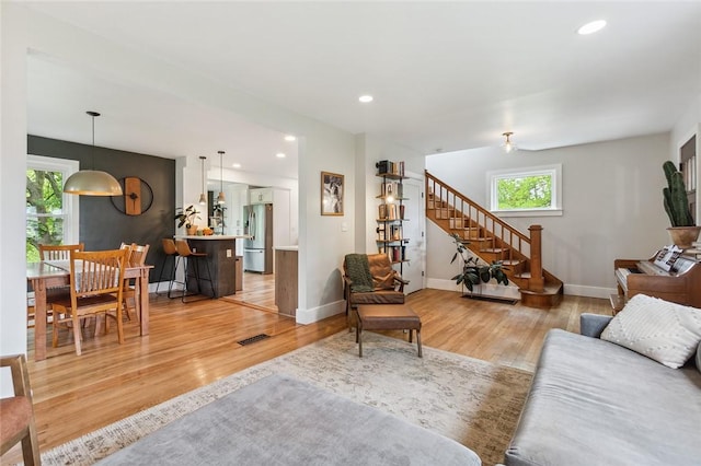 314 Hamilton St, Benton, NY 14527 - living area featuring light wood-type flooring, healthy amount of natural light, stairs, and recessed lighting