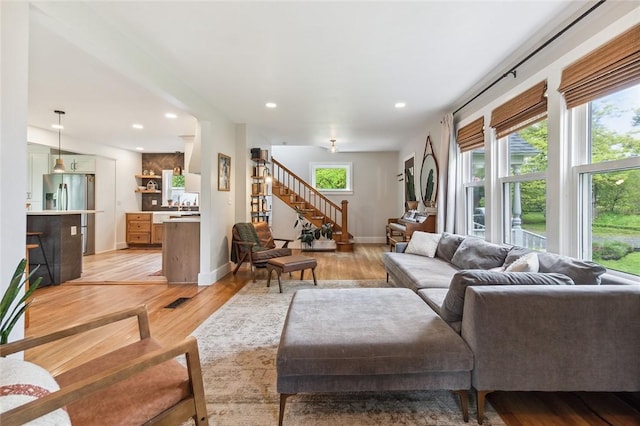 314 Hamilton St, Benton, NY 14527 - living area featuring healthy amount of natural light, light wood-style floors, stairway, baseboards, and recessed lighting