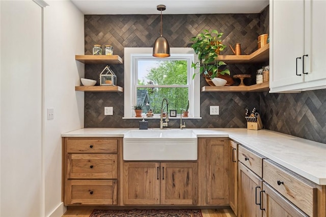 314 Hamilton St, Benton, NY 14527 - kitchen with open shelves, a sink, backsplash, and pendant lighting