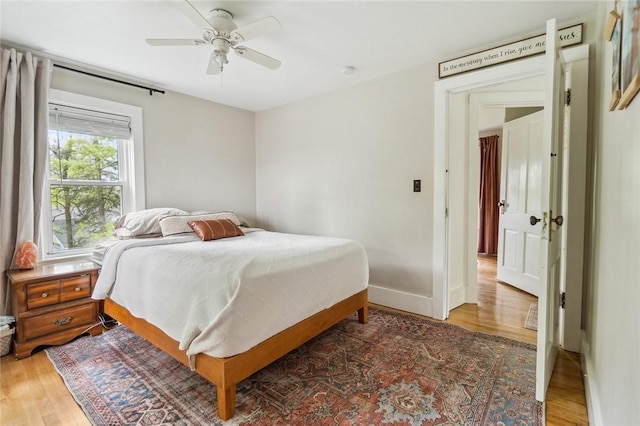 314 Hamilton St, Benton, NY 14527 - bedroom with light wood-style flooring, baseboards, and a ceiling fan
