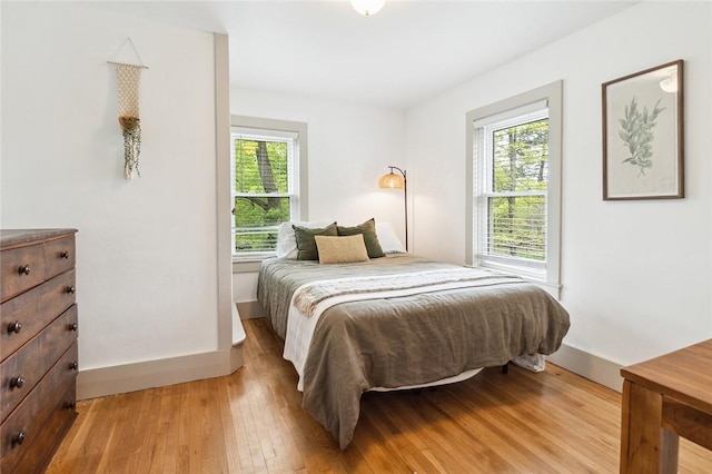 314 Hamilton St, Benton, NY 14527 - bedroom with multiple windows, light wood finished floors, and baseboards