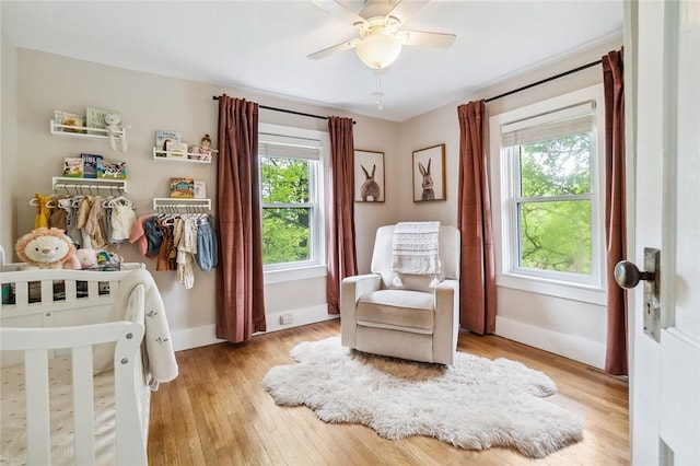 314 Hamilton St, Benton, NY 14527 - bedroom featuring multiple windows, baseboards, and light wood-style floors