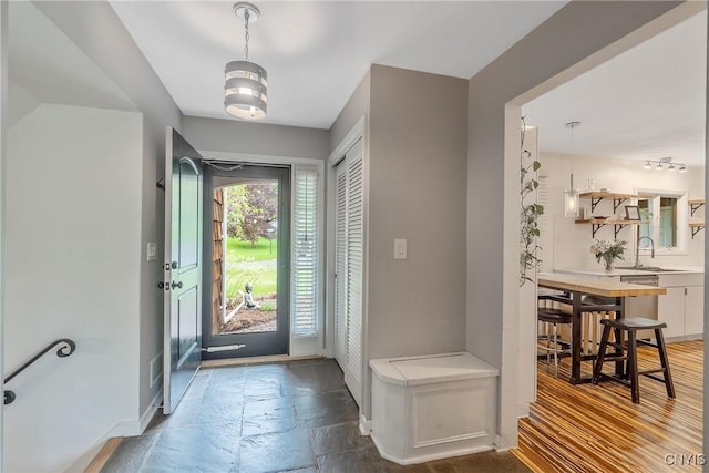 9 Bishop Dr, Manlius, NY 13066 - foyer entrance featuring stone tile floors and baseboards