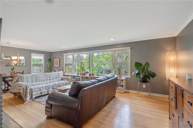 9 Bishop Dr, Manlius, NY 13066 - living room with crown molding, light wood-type flooring, a chandelier, baseboards, and recessed lighting