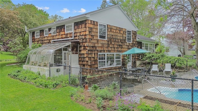 9 Bishop Dr, Manlius, NY 13066 - view of side of home featuring a sunroom and a patio area
