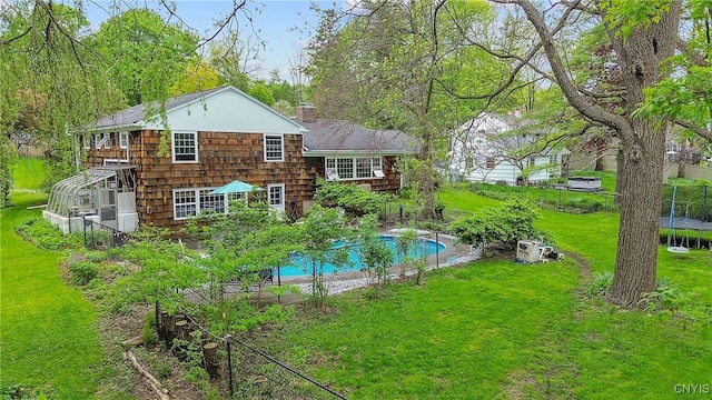 9 Bishop Dr, Manlius, NY 13066 - rear view of property with an outdoor pool and a chimney