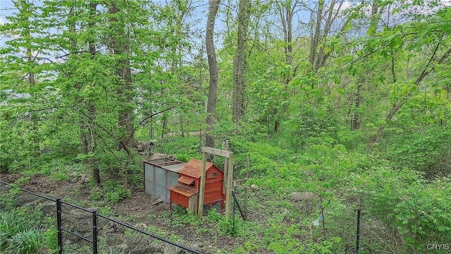 9 Bishop Dr, Manlius, NY 13066 - view of yard with fence, a forest view, and exterior structure