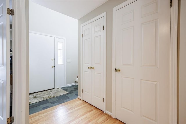 foyer entrance with light wood-style flooring
